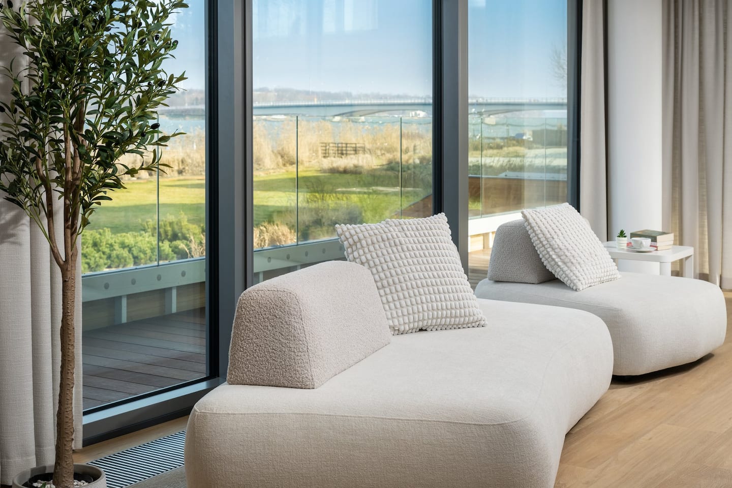 Waterfront apartment with a garden